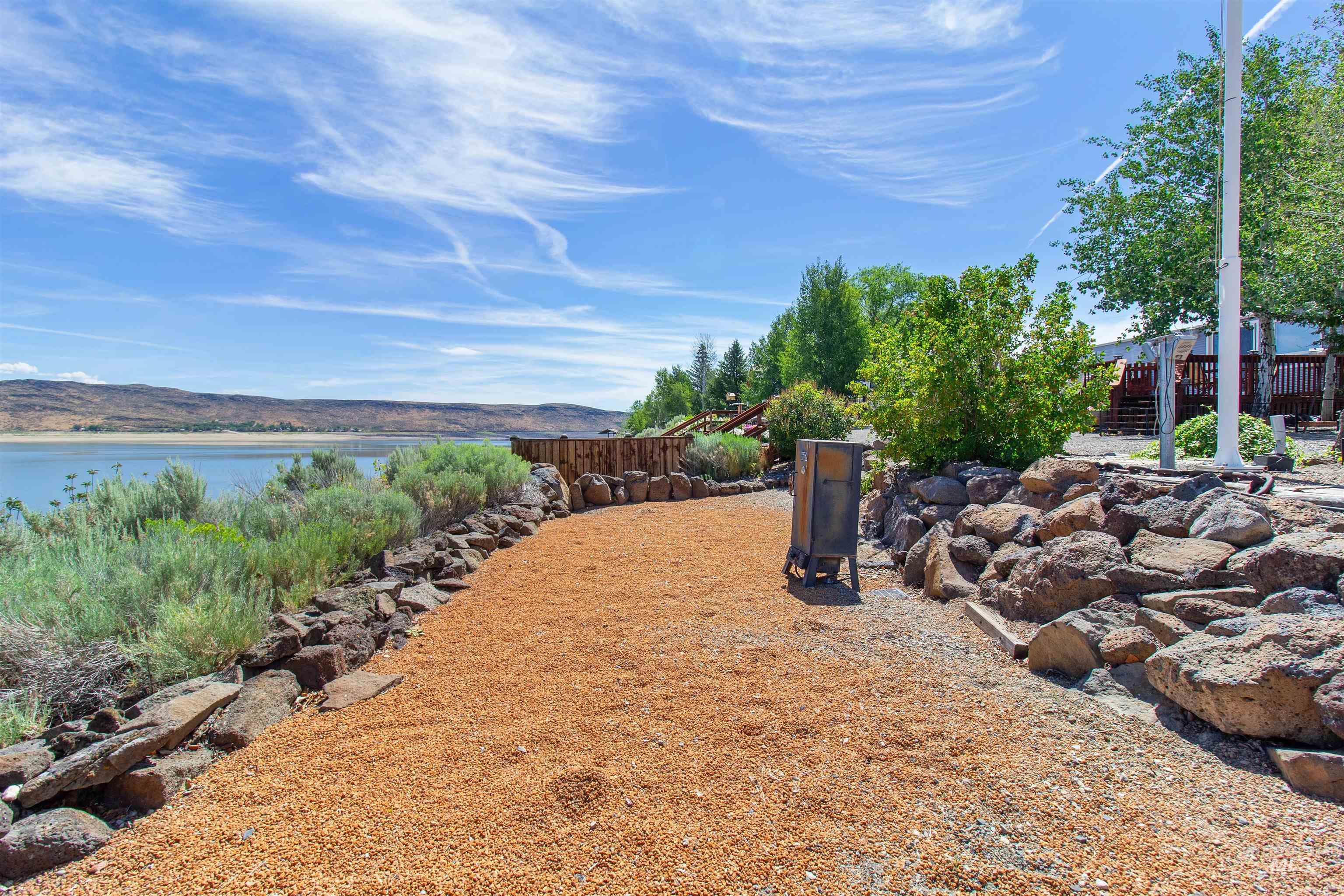 106 West Magic Road Shoshone, ID 83352 - Photo 37 of 45 Wood chip pathway bordering a natural rock retaining wall