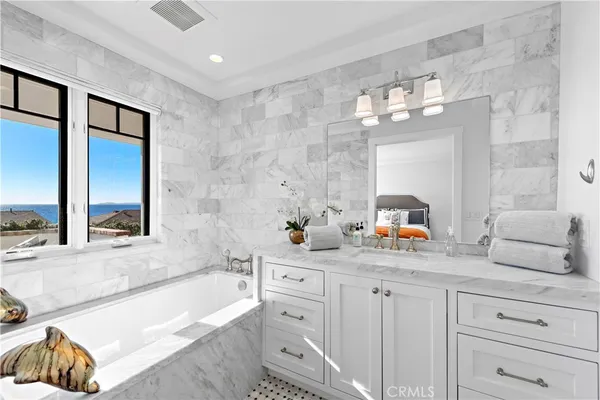a view of a patio with couches table and chairs with potted plants