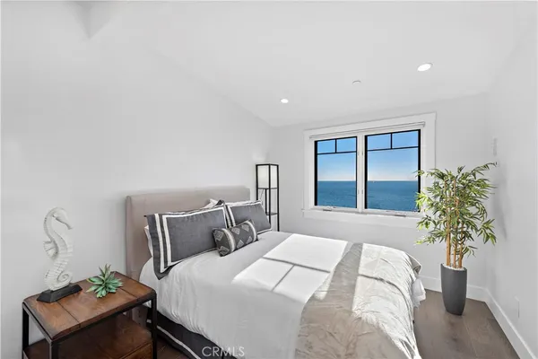 a view of a terrace with furniture and a garden