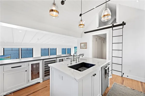 a kitchen with a stove and a refrigerator
