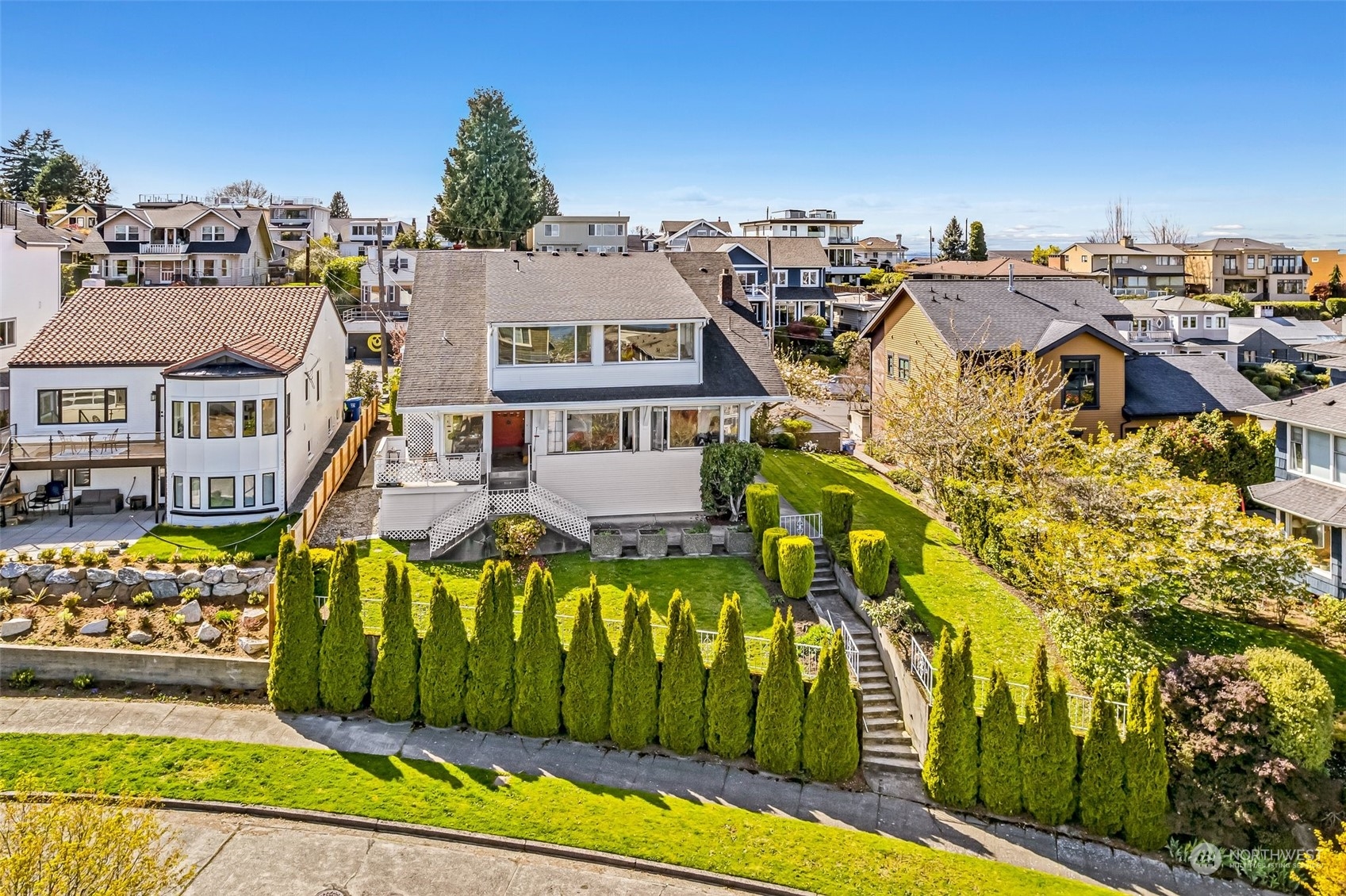 an aerial view of a residential apartment building with a yard