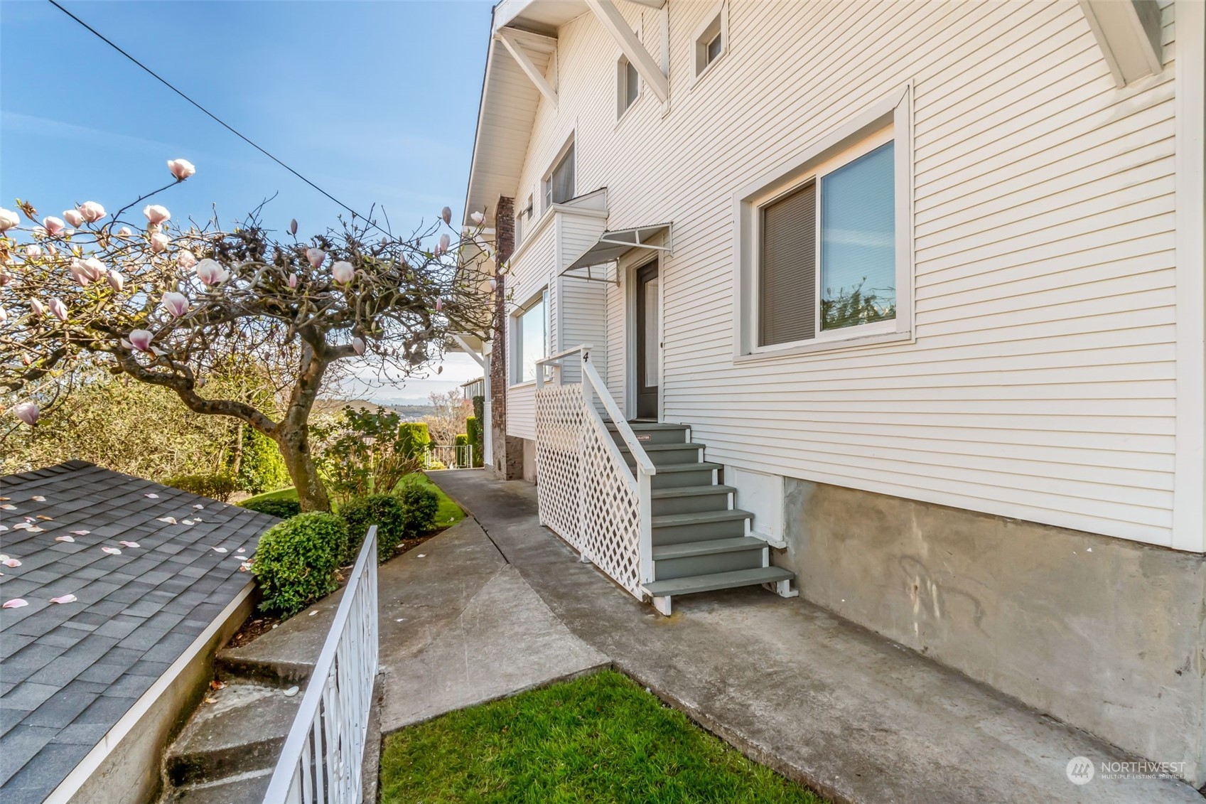 1330 California Avenue Southwest Seattle, WA 98116 - Photo 17 of 24 a view of a house with backyard and trees