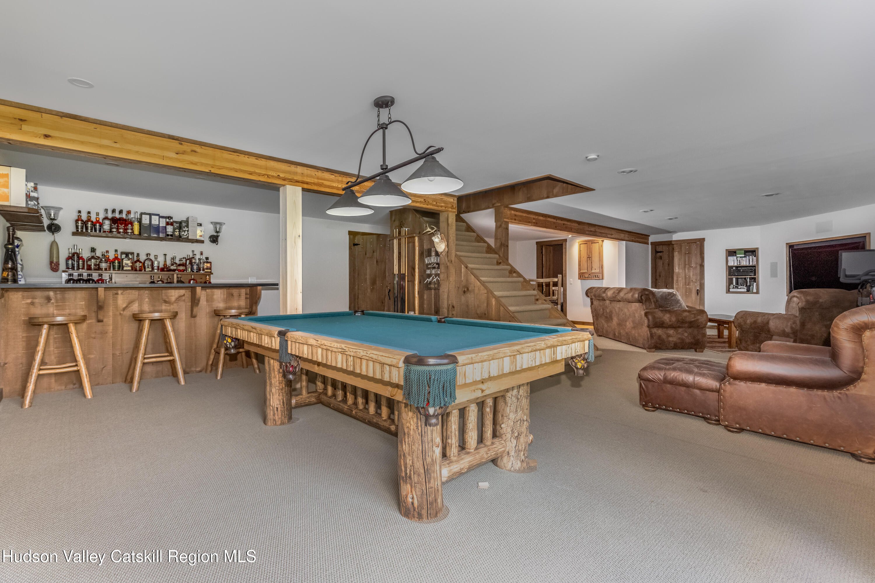 688 Bruce Porn Road Gilboa, NY 12167 - Photo 87 of 104 a living room with furniture a flat screen tv and a table