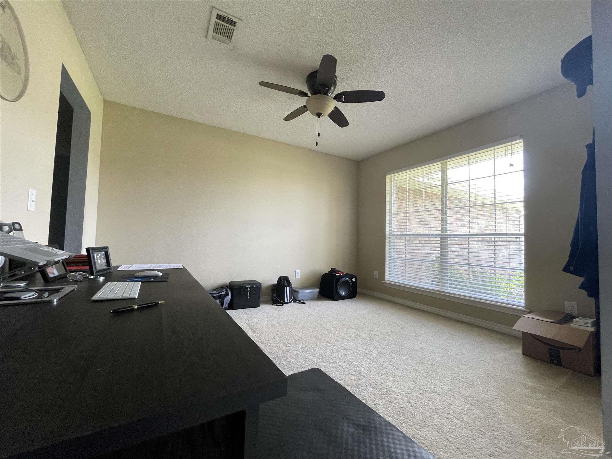 7025 Boo Lane Pensacola, FL 32526 - Photo 18 of 35 a bedroom with a bed and a window