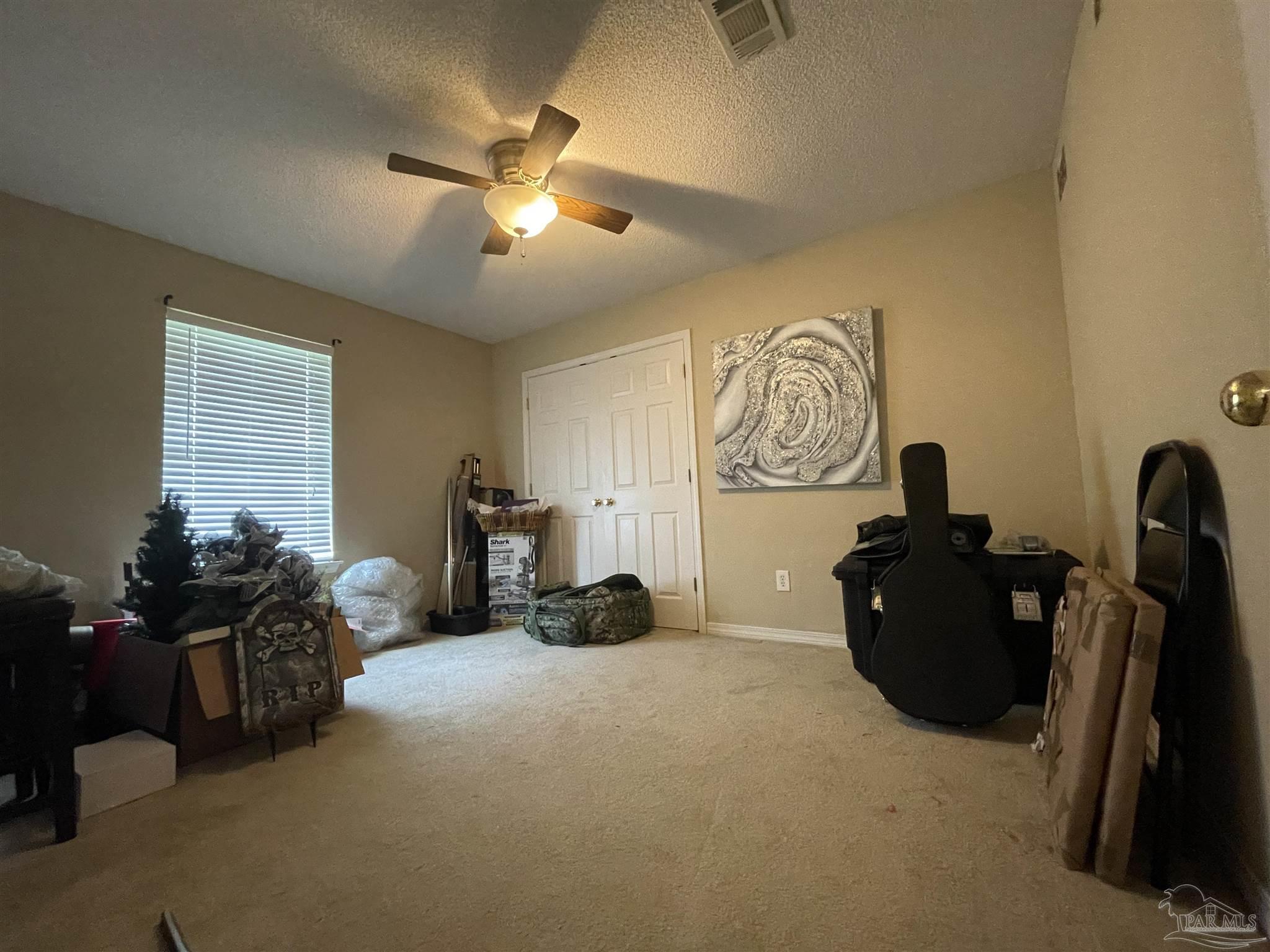 7025 Boo Lane Pensacola, FL 32526 - Photo 20 of 35 a living room with furniture and a window