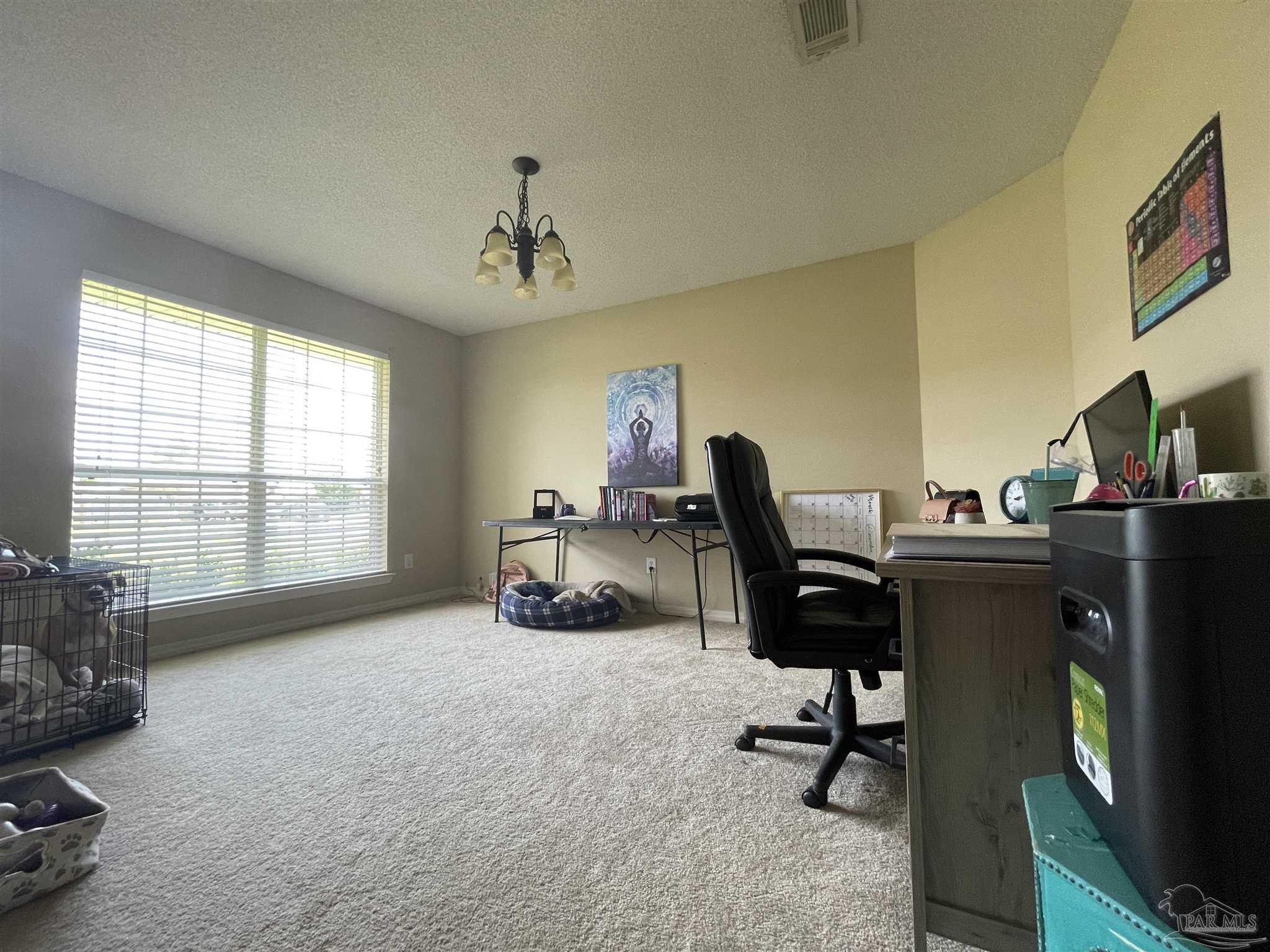 7025 Boo Lane Pensacola, FL 32526 - Photo 23 of 35 a view of a workspace with furniture and a window