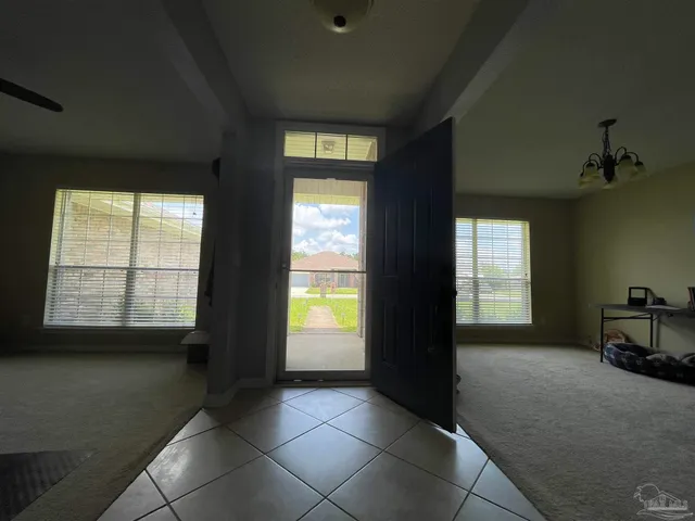 a view of an empty room and window