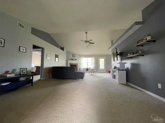 a view of a livingroom with furniture and a chandelier