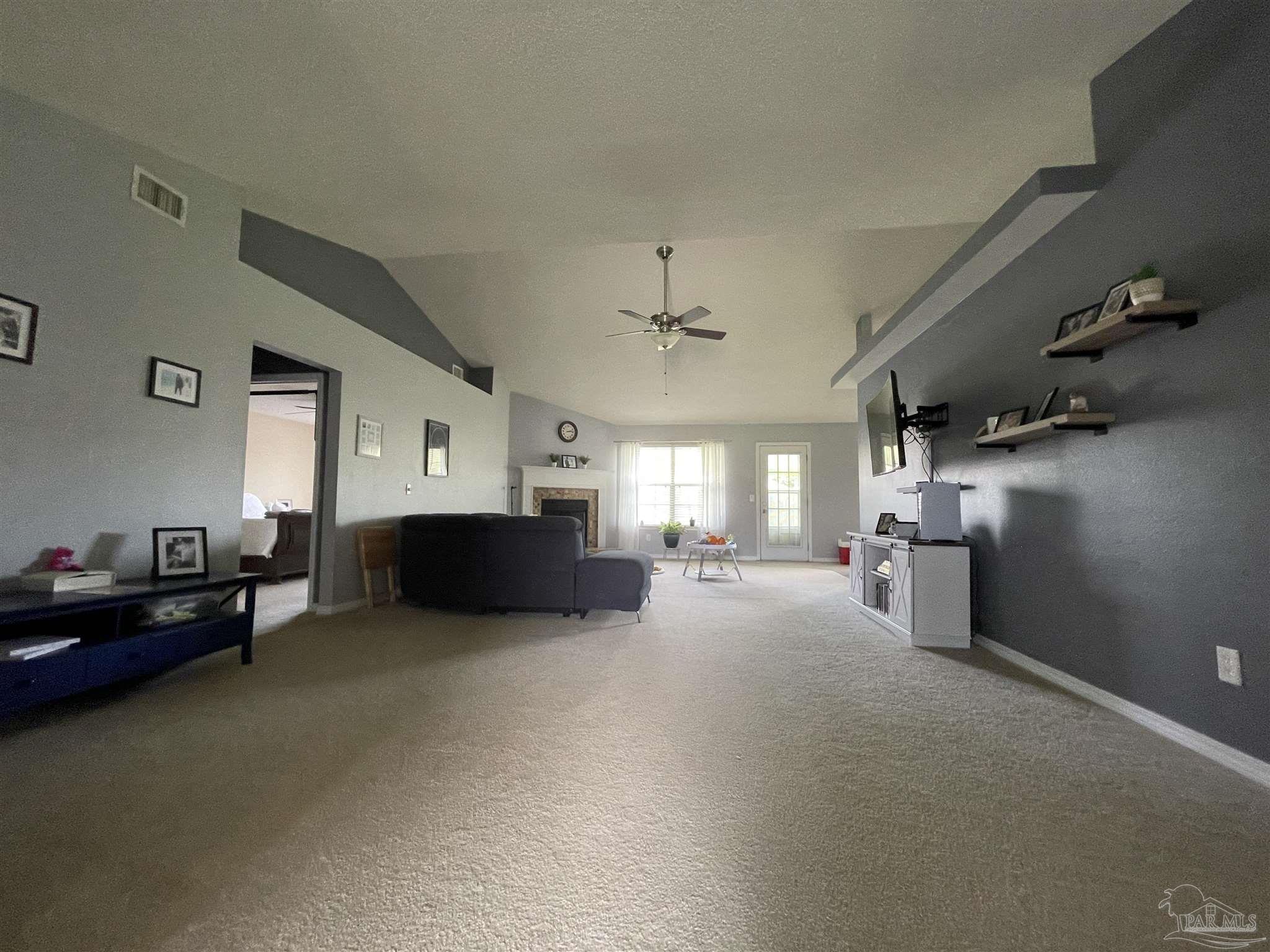7025 Boo Lane Pensacola, FL 32526 - Photo 7 of 35 a view of a livingroom with furniture and a chandelier