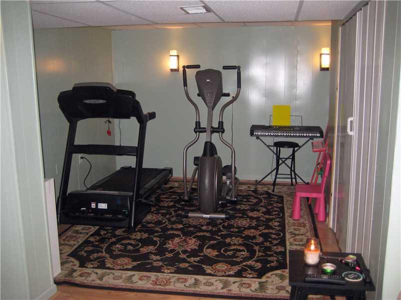 3203 McRoberts Road Castle Shannon, PA 15234 - Photo 14 of 25 Basement/Game Room. 2nd view the "home gym" is also in the finished gameroom! this space can be soo many things, it is adjacent to a 11x5 laundry room w extra space for storage