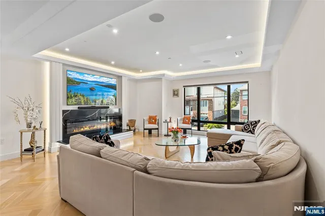 a large bedroom with a bed and a large window