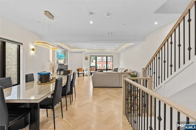 a living room with furniture and a bookshelf