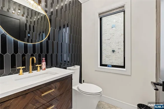 a view of a roof deck with couches and sky view