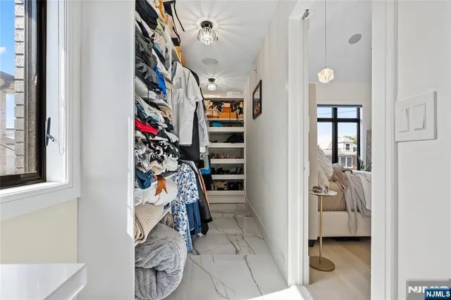 a view of a backyard with plants and a patio