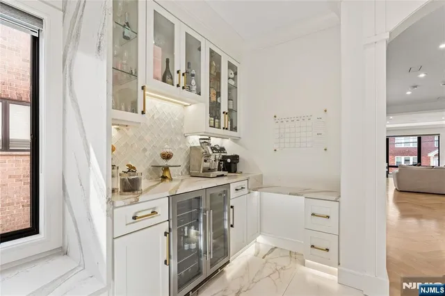 a living room with furniture and a dining table with wooden floor