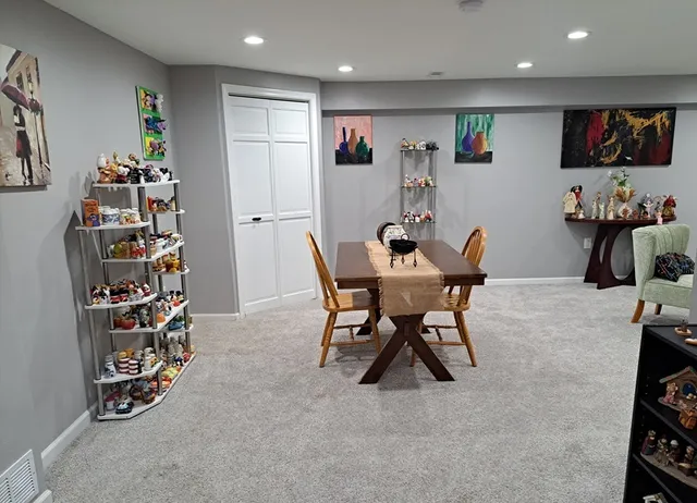 a view of a livingroom with furniture and a flat screen tv