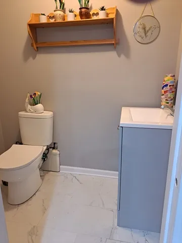 a bathroom with a toilet and a sink
