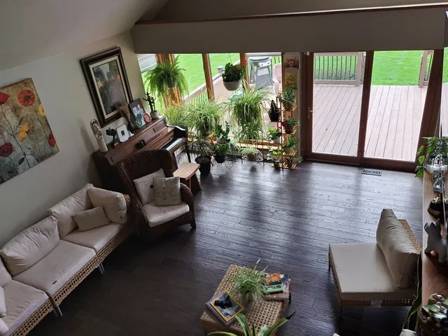a living room with furniture and a large window