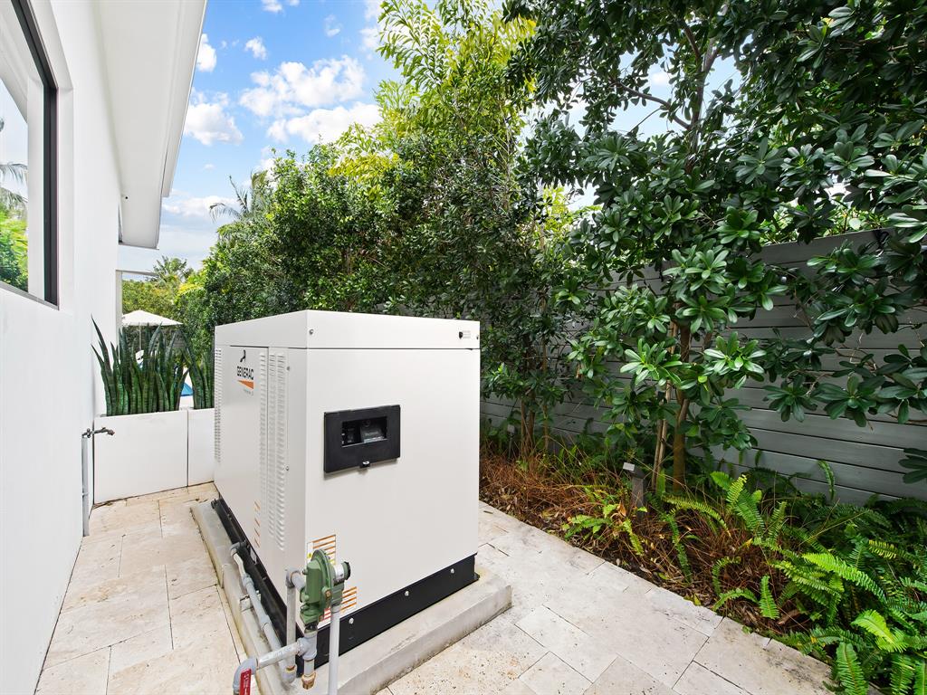 1710 Middle River Drive Fort Lauderdale, FL 33305 - Photo 12 of 47 a view of washer and dryer with tree in front of it
