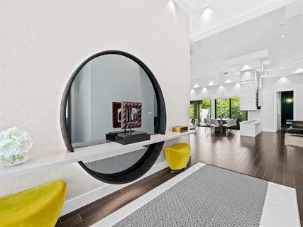 a swimming pool with dining table and chairs