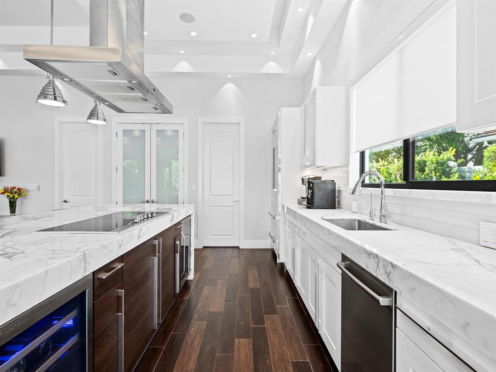 1710 Middle River Drive Fort Lauderdale, FL 33305 - Photo 19 of 47 a large kitchen with a stove and a sink