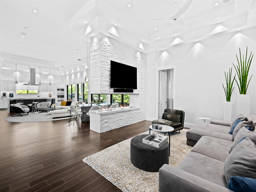 1710 Middle River Drive Fort Lauderdale, FL 33305 - Photo 2 of 47 a living room with furniture and a flat screen tv