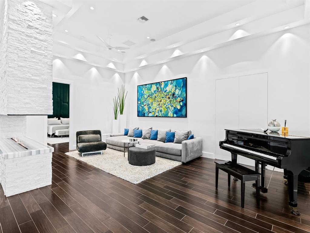 1710 Middle River Drive Fort Lauderdale, FL 33305 - Photo 21 of 47 a living room with furniture wooden floor and a flat screen tv