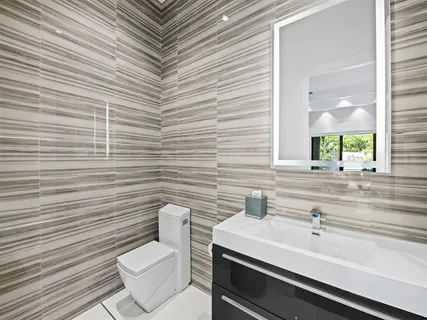 a bathroom with a toilet and a sink