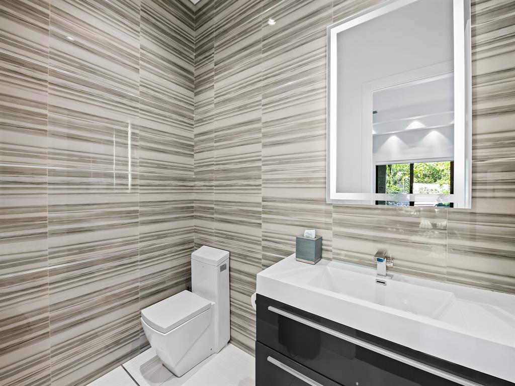 1710 Middle River Drive Fort Lauderdale, FL 33305 - Photo 23 of 47 a bathroom with a toilet and a sink