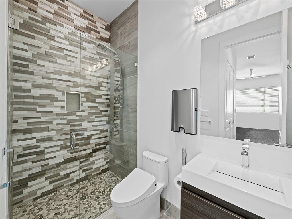 1710 Middle River Drive Fort Lauderdale, FL 33305 - Photo 26 of 47 a bathroom with a toilet sink and shower