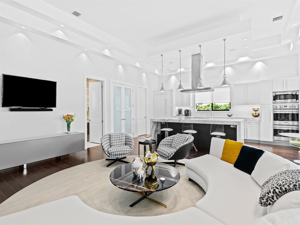 1710 Middle River Drive Fort Lauderdale, FL 33305 - Photo 3 of 47 a living room with furniture and a flat screen tv