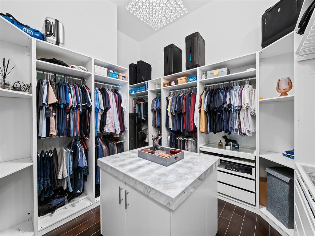 1710 Middle River Drive Fort Lauderdale, FL 33305 - Photo 31 of 47 a view of walk in closet with clothes and shoes