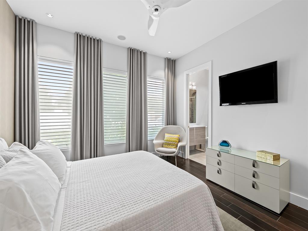 1710 Middle River Drive Fort Lauderdale, FL 33305 - Photo 33 of 47 a bedroom with a bed and a flat screen tv