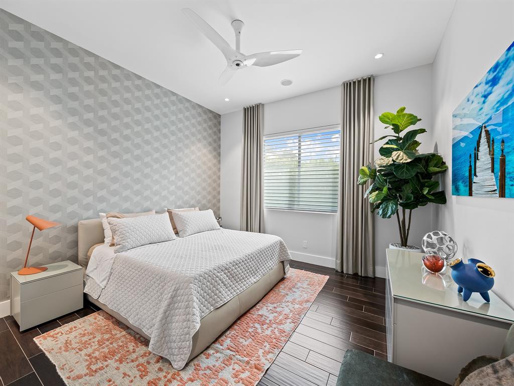 1710 Middle River Drive Fort Lauderdale, FL 33305 - Photo 35 of 47 a bedroom with a bed and a potted plant