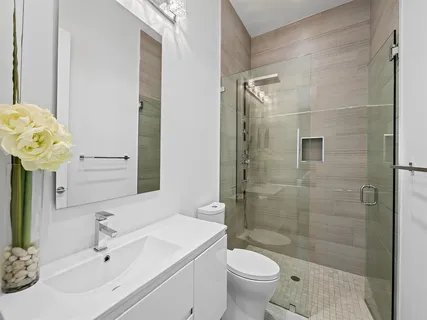 a bathroom with a sink toilet and shower