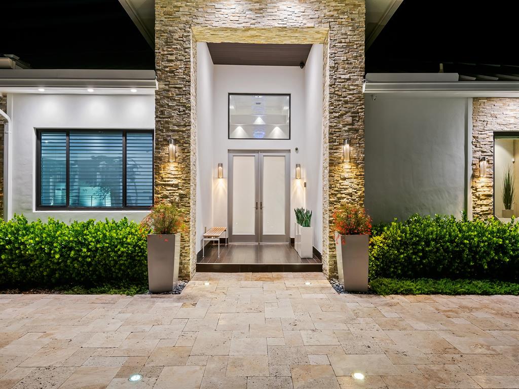 1710 Middle River Drive Fort Lauderdale, FL 33305 - Photo 43 of 47 a front view of a house with a yard