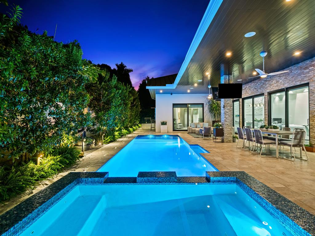 1710 Middle River Drive Fort Lauderdale, FL 33305 - Photo 47 of 47 a view of swimming pool with outdoor seating and a patio