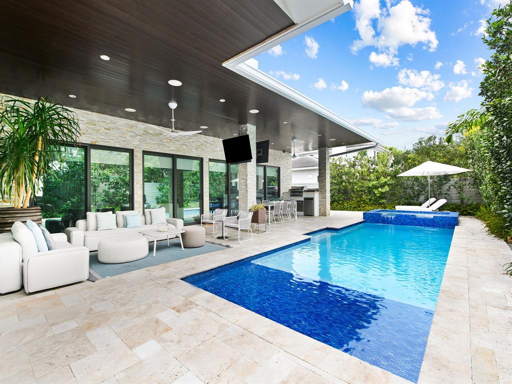 1710 Middle River Drive Fort Lauderdale, FL 33305 - Photo 6 of 47 a living room with patio furniture and a large tree