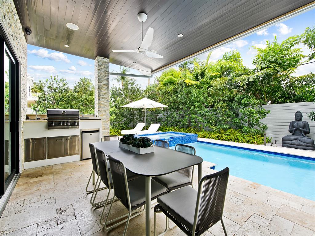 1710 Middle River Drive Fort Lauderdale, FL 33305 - Photo 7 of 47 a view of a dining table and chairs in the patio