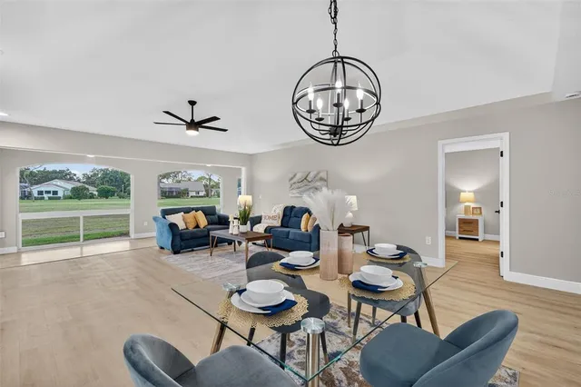 a view of a livingroom with furniture window and wooden floor