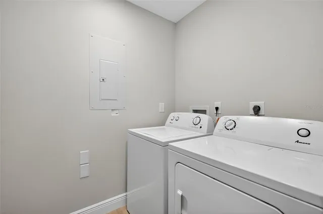 a utility room with dryer and washer