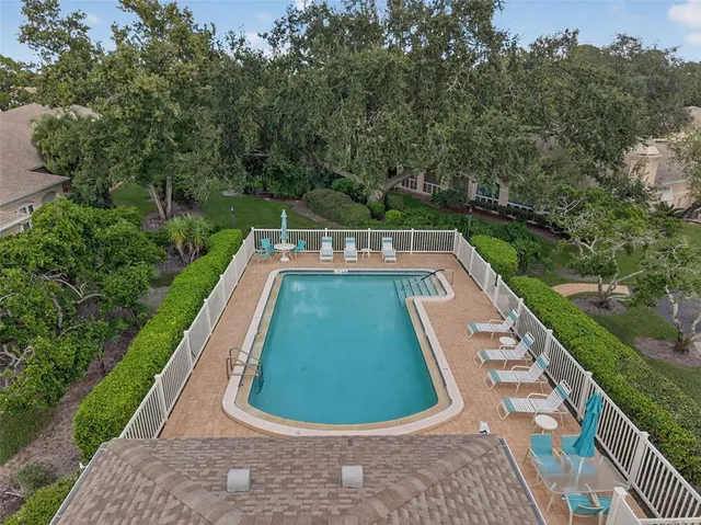 a view of a swimming pool with a garden