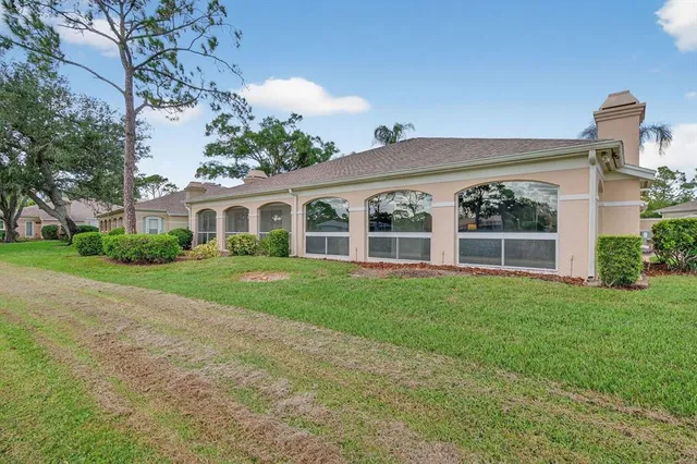 a view of a house with a garden