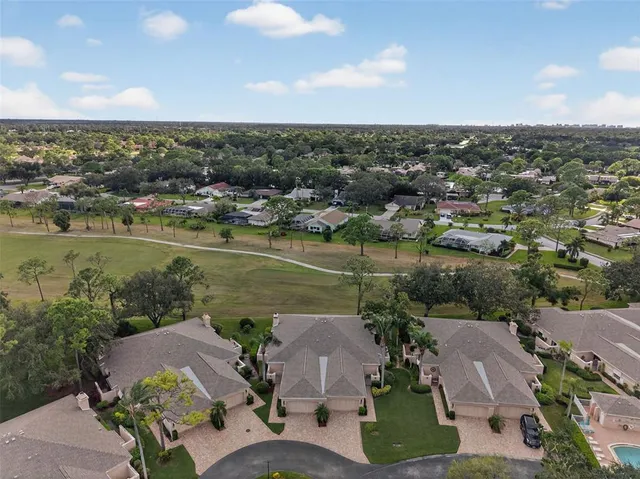 an aerial view of a house with lake view