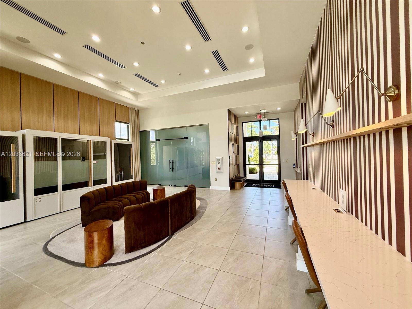 11942 Southwest 243rd Street Homestead, FL 33032 - Photo 41 of 50 a lobby with furniture and floor to ceiling window