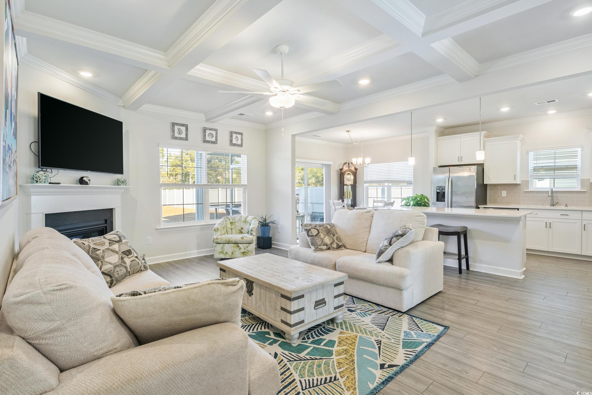 724 Enchantment Loop Myrtle Beach, SC 29588 - Photo 7 of 39 Living room featuring beamed ceiling, ceiling fan