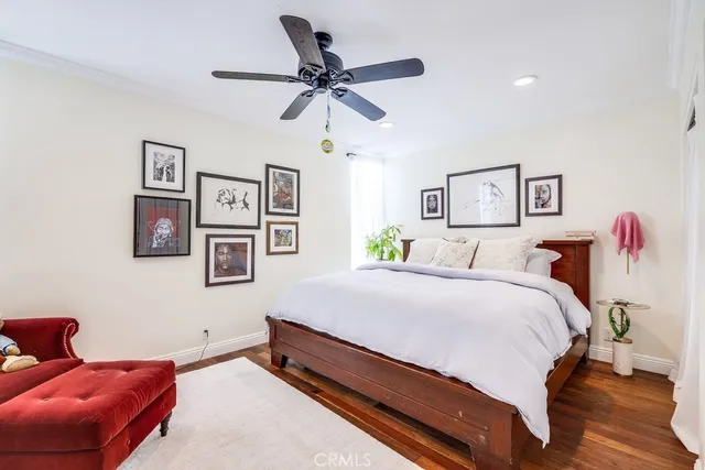 a bedroom with double bed and a window