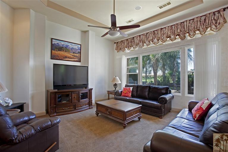 59 Calle Del Norte Rancho Mirage, CA 92270 - Photo 12 of 25 a living room with furniture a flat screen tv and a large window