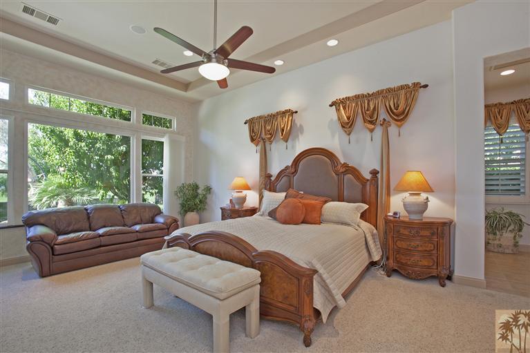 59 Calle Del Norte Rancho Mirage, CA 92270 - Photo 14 of 25 a bedroom with a bed and a large window