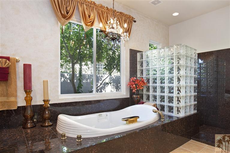 59 Calle Del Norte Rancho Mirage, CA 92270 - Photo 16 of 25 a bath tub sitting in a bathroom next to a window
